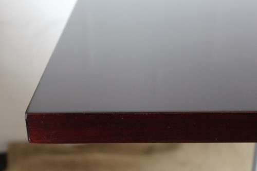 A stylish square mahogany wood-top cafe table with a brushed steel centre leg - two available