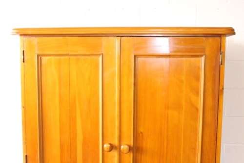 A stunning, well made double folding-door Yellow wood wardrobe with two storage drawers