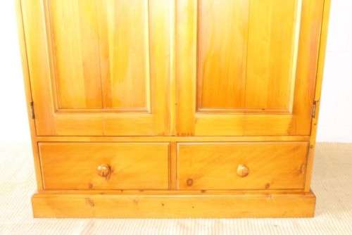 A stunning, well made double folding-door Yellow wood wardrobe with two storage drawers