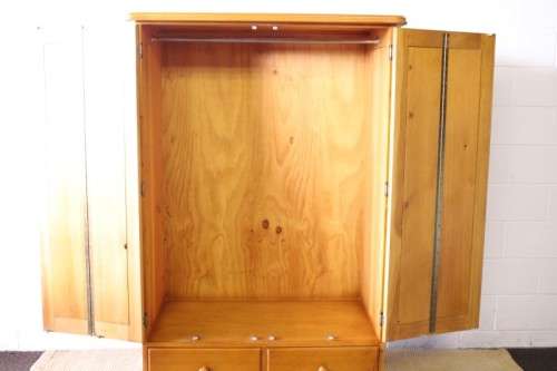 A stunning, well made double folding-door Yellow wood wardrobe with two storage drawers
