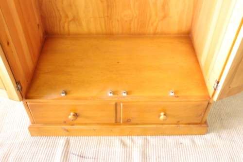 A stunning, well made double folding-door Yellow wood wardrobe with two storage drawers