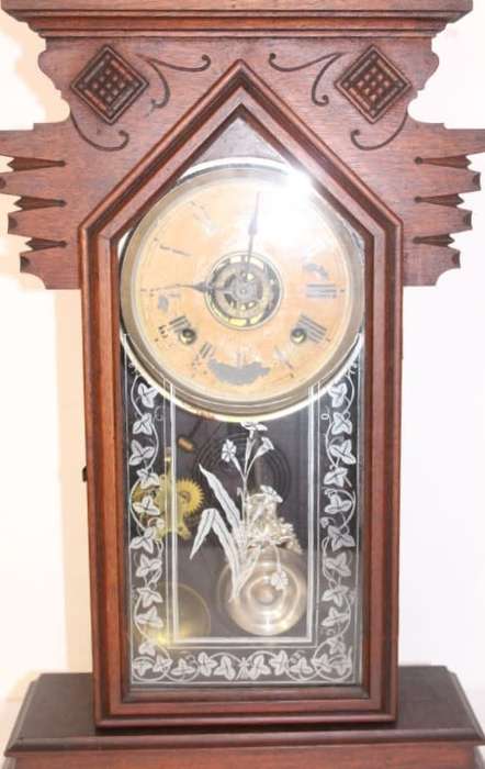 A beautiful and rare hand carved antique Ansonia "Gingerbread" shelf mantle clock with alarm bell