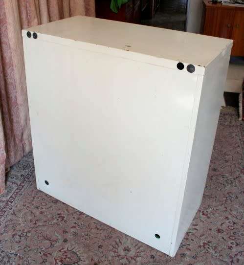 A sturdy metal multi purpose cabinet with a large cupboard, needs some tlc, perfect to paint!