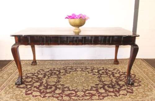 A solid blackwood scalloped edge ball & claw 8-seater dining suite with a separate cutlery table