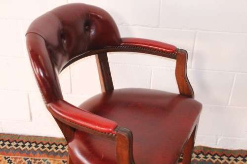 **RS17** A pair of vintage chateau-red leather visitors/ occasional armchairs w/ deep button backs