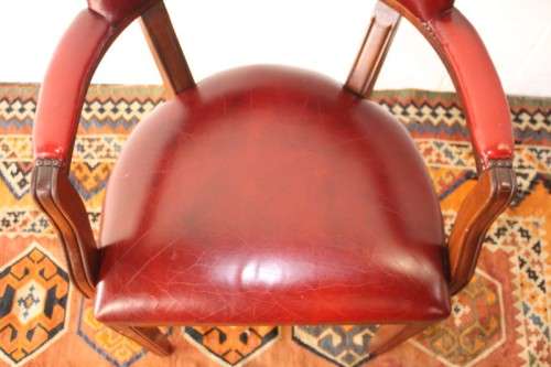**RS17** A pair of vintage chateau-red leather visitors/ occasional armchairs w/ deep button backs
