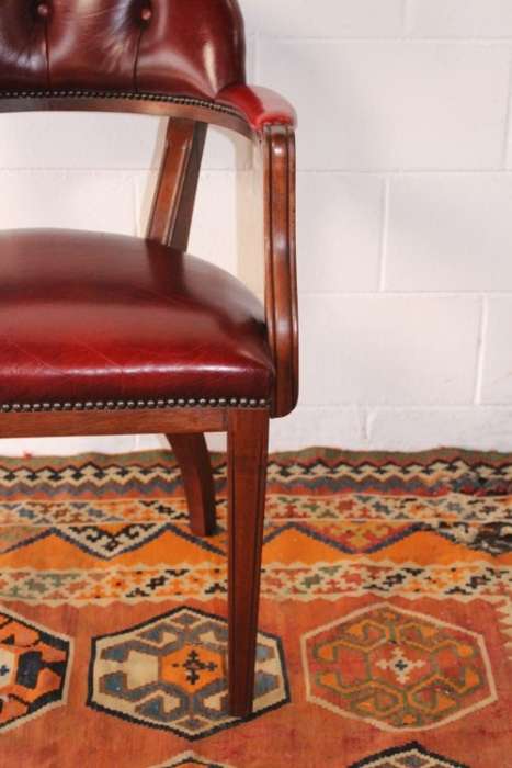 **RS17** A pair of vintage chateau-red leather visitors/ occasional armchairs w/ deep button backs