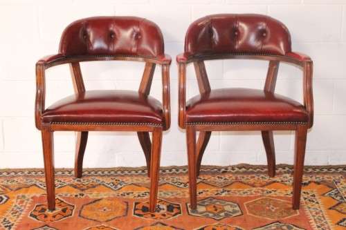 **RS17** A pair of vintage chateau-red leather visitors/ occasional armchairs w/ deep button backs