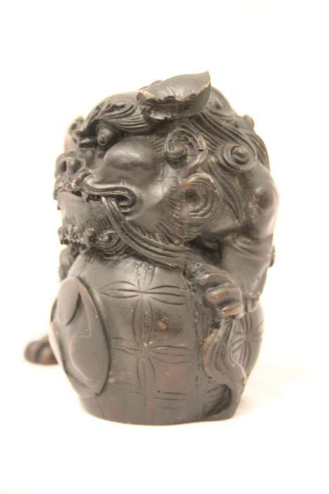 An awesome black oriental resin foo dog/ temple lion ornament