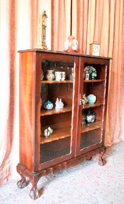 A beautifully made vintage solid Imbuia ball & claw two glass door showcase/ bookcase