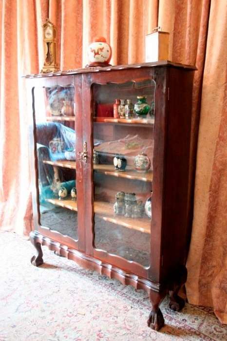 A beautifully made vintage solid Imbuia ball & claw two glass door showcase/ bookcase
