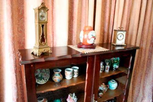 A beautifully made vintage solid Imbuia ball & claw two glass door showcase/ bookcase