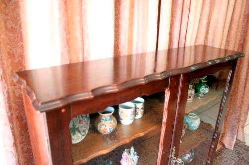A beautifully made vintage solid Imbuia ball & claw two glass door showcase/ bookcase