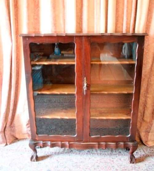 A beautifully made vintage solid Imbuia ball & claw two glass door showcase/ bookcase