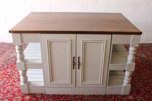 A stunning larger kitchen centre island with two large pot drawers, double-door cupboard & shelves