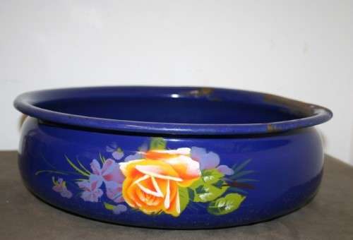 A wonderful vintage dark blue w/ hand painted flowers enamel wash basin, pitcher & chamber pot set.