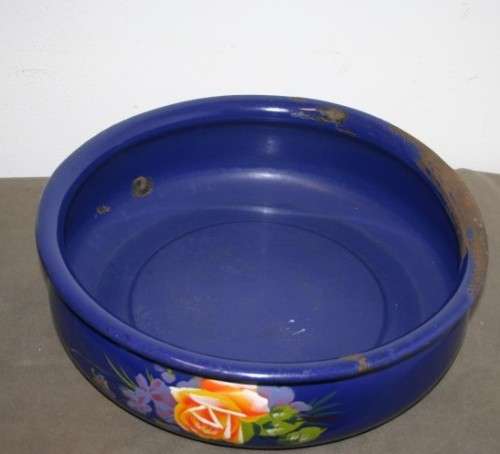 A wonderful vintage dark blue w/ hand painted flowers enamel wash basin, pitcher & chamber pot set.
