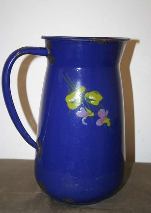 A wonderful vintage dark blue w/ hand painted flowers enamel wash basin, pitcher & chamber pot set.