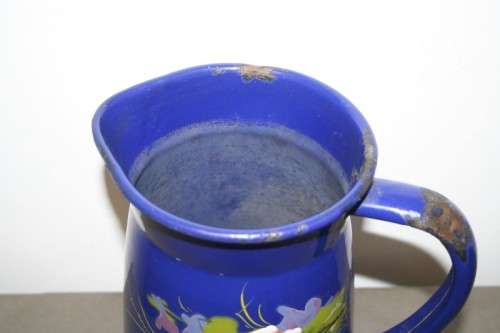 A wonderful vintage dark blue w/ hand painted flowers enamel wash basin, pitcher & chamber pot set.