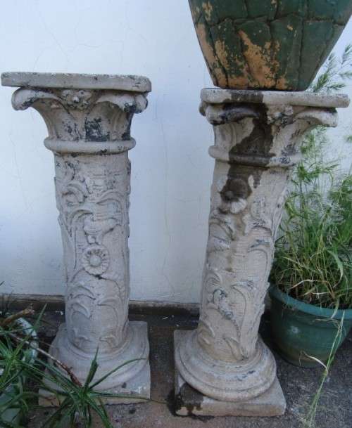 Two lovely concrete pillars. Perfect in a garden or drive way with a statue or plant!!
