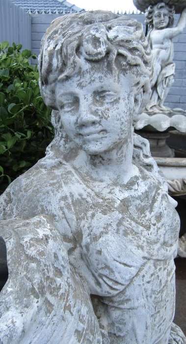 A beautiful concrete free standing water feature statue of a lady. Stunning in a fountain or garden!
