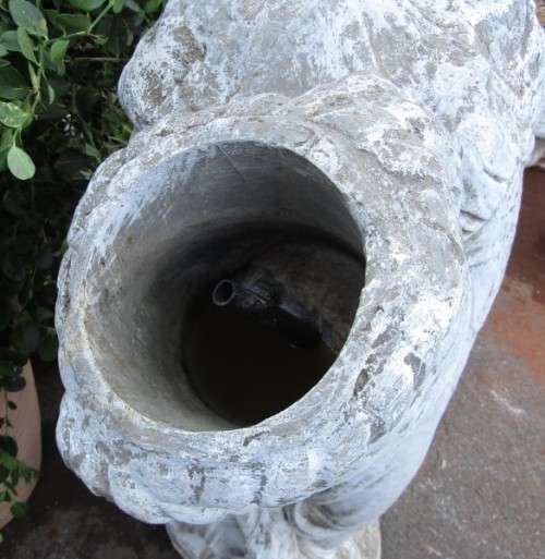 A beautiful concrete free standing water feature statue of a lady. Stunning in a fountain or garden!