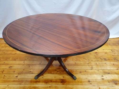 An exquisite claw footed Regency style round dining table (134cm x 75cm). Xmas sale