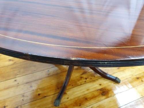 An exquisite claw footed Regency style round dining table (134cm x 75cm). Xmas sale