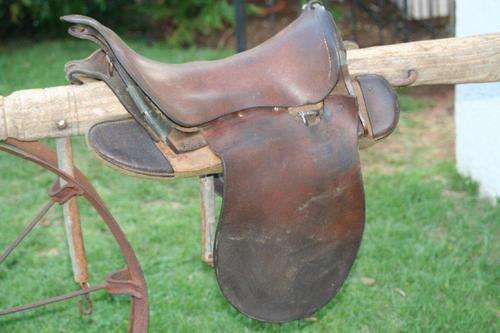 A STUNNING OLD SADDLE - SO MUCH POTENTIAL; THEY EVEN USE THEM AS BAR STOOLS!!! VERY COLLECTABLE...