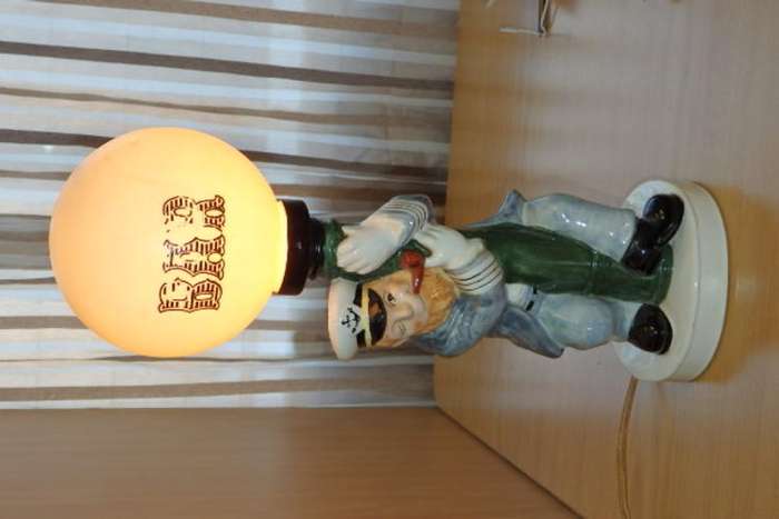 A FANTASTIC ELWECO PORCELAIN BAR LAMP OF AN DRUNK SEA CAPTAIN HOLDING ONTO A STREET LAMP