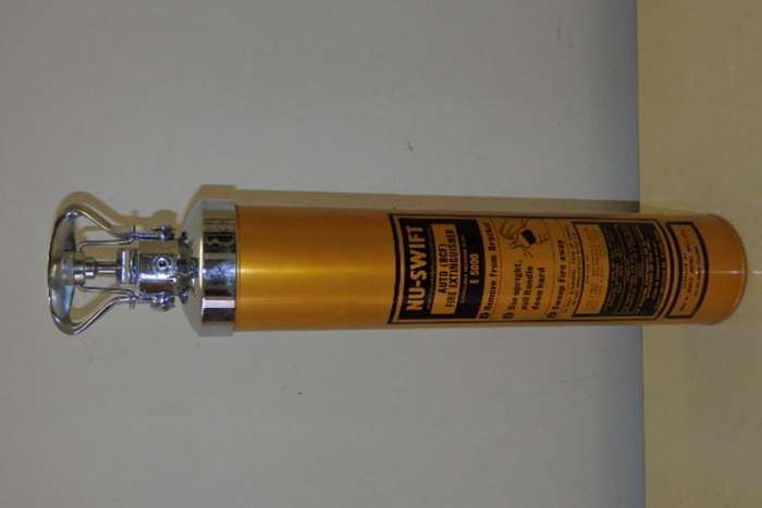 AN AWESOME VINTAGE (c1980's) GOLD COLOURED NU-SWIFT AUTO BFC MODEL E5000 FIRE EXTINGUISHER