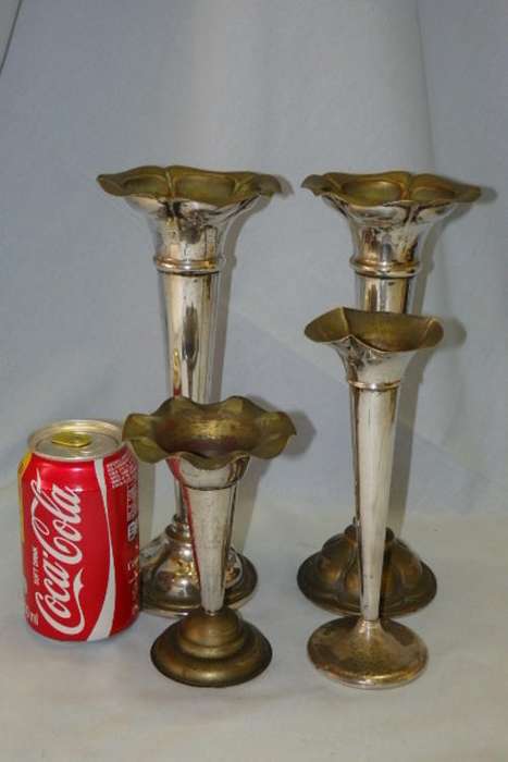 AN AWESOME COLLECTION OF FOUR ANTIQUE SILVER PLATED (ON BRASS) "FLUTED" CANDLE HOLDERS