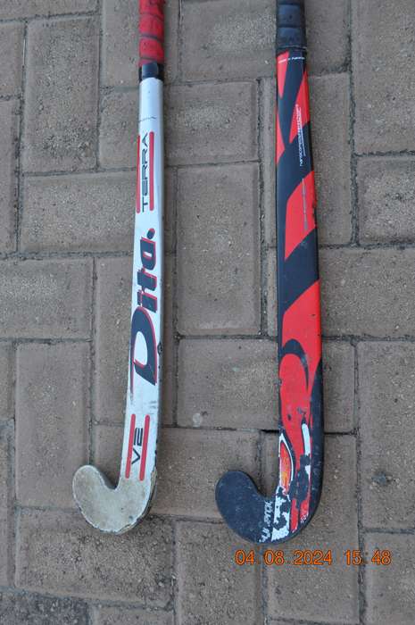 Hockey Sticks x 2 Plus 2 Balls