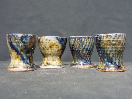 Set of Four Glazed Pottery Egg Cups