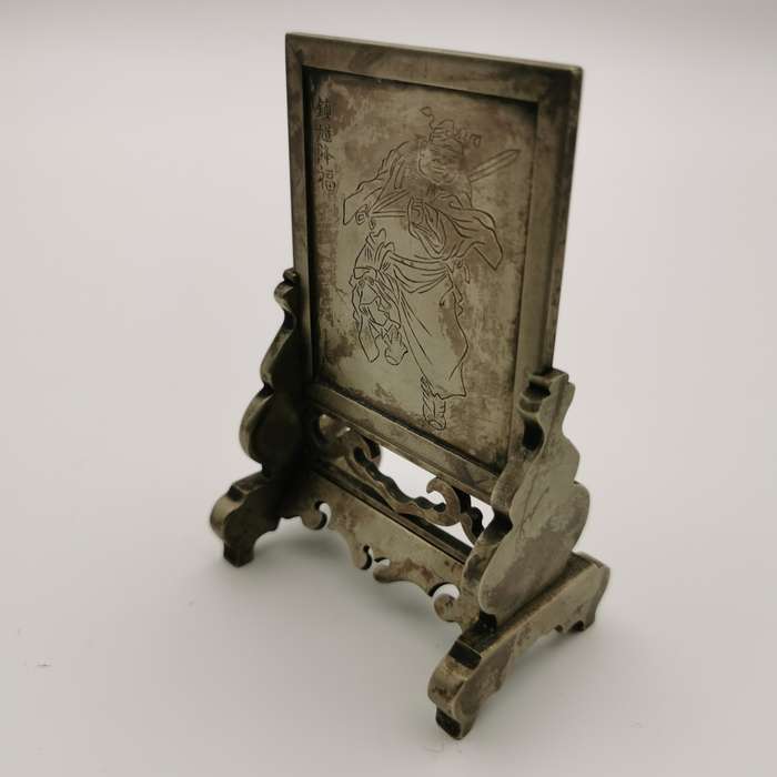 Decorated white copper ornament featuring the god Zhong Kui from the late Chinese Qing Dynasty