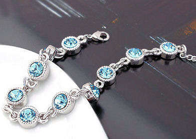 LOVELY SWAROVSKI BLUE TOPAZ TENNIS BRACELET