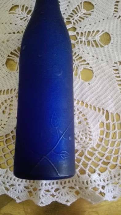 Frosted blue glass bottle