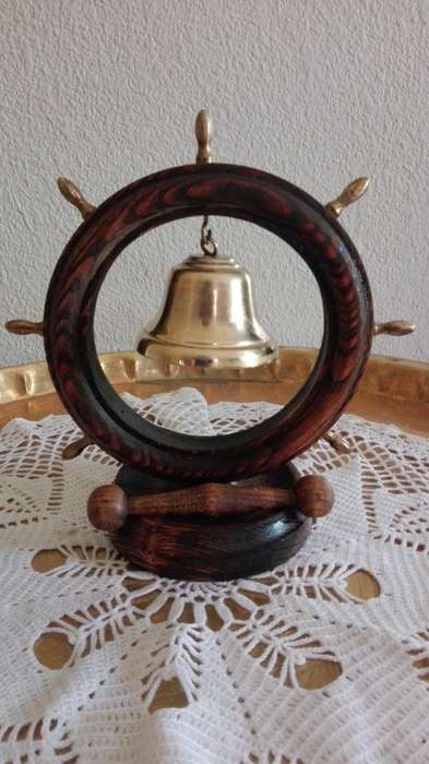 Copper and wooden boat wheel bell.