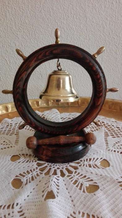 Copper and wooden boat wheel bell.