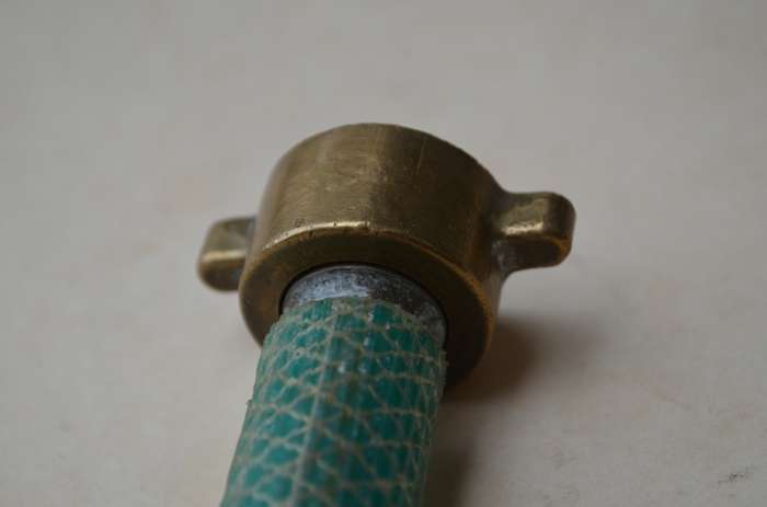 Brass antique hose pipe adjustable cone spray nozzle with the garden tap attachment. A nice prop.