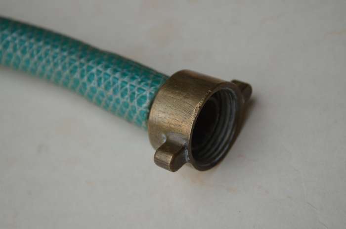 Brass antique hose pipe adjustable cone spray nozzle with the garden tap attachment. A nice prop.