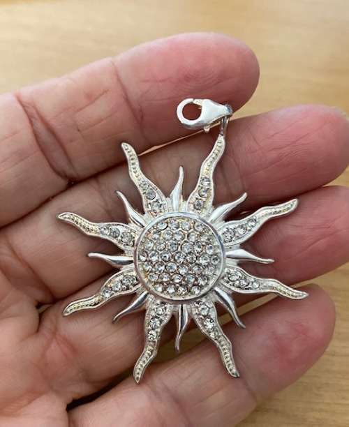 Silver plated sunburst pendant