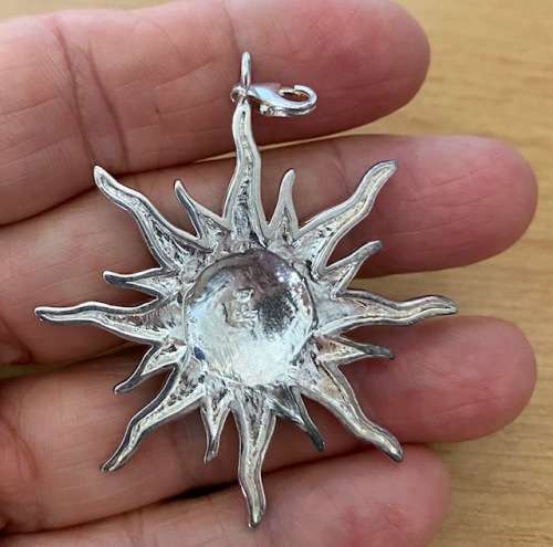 Silver plated sunburst pendant