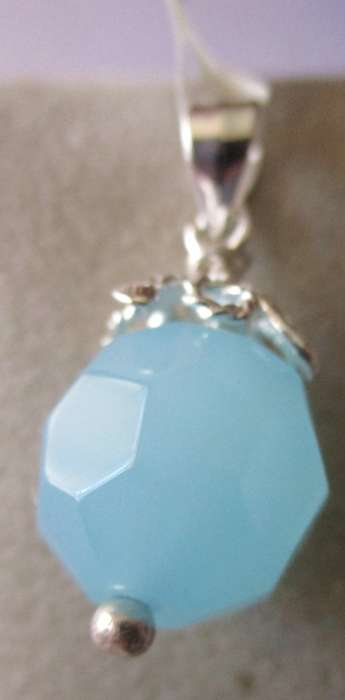925 Sterling Silver and Blue Topaz Pendant.