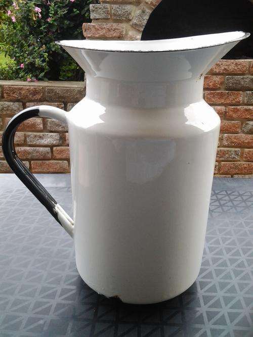 HUGE ANTIQUE WHITE WITH BLACK TRIM ENAMEL JUG