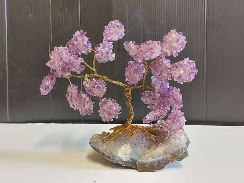 STUNNING AMETHYST CRYSTALS TREE MOUNTED ON A SMALL SEGMENT OF AN AMETHYST GEODE
