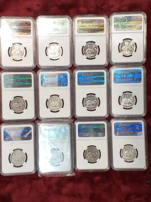 A SET OF 12 x 2000 RSA R5 COINS - MANDELA - NGC GRADED XF 40 TO MS 66 - IN PLASTIC BOX - RARE GRADES