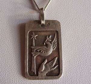 STERLING SILVER NECKLACE WITH A MAGICAL SILVER PENDANT