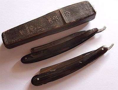 TWO ANTIQUE CUTTHROAT RAZORS