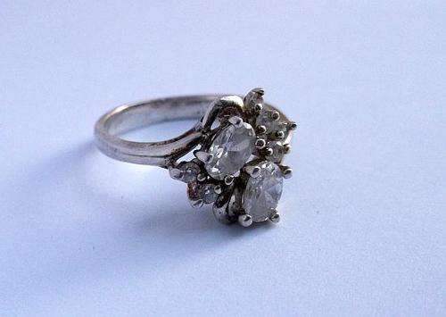 A CLASSY STERLING SILVER RING SET WITH GORGEOUSLY FACETED STONES ...MUST HAVE !!!